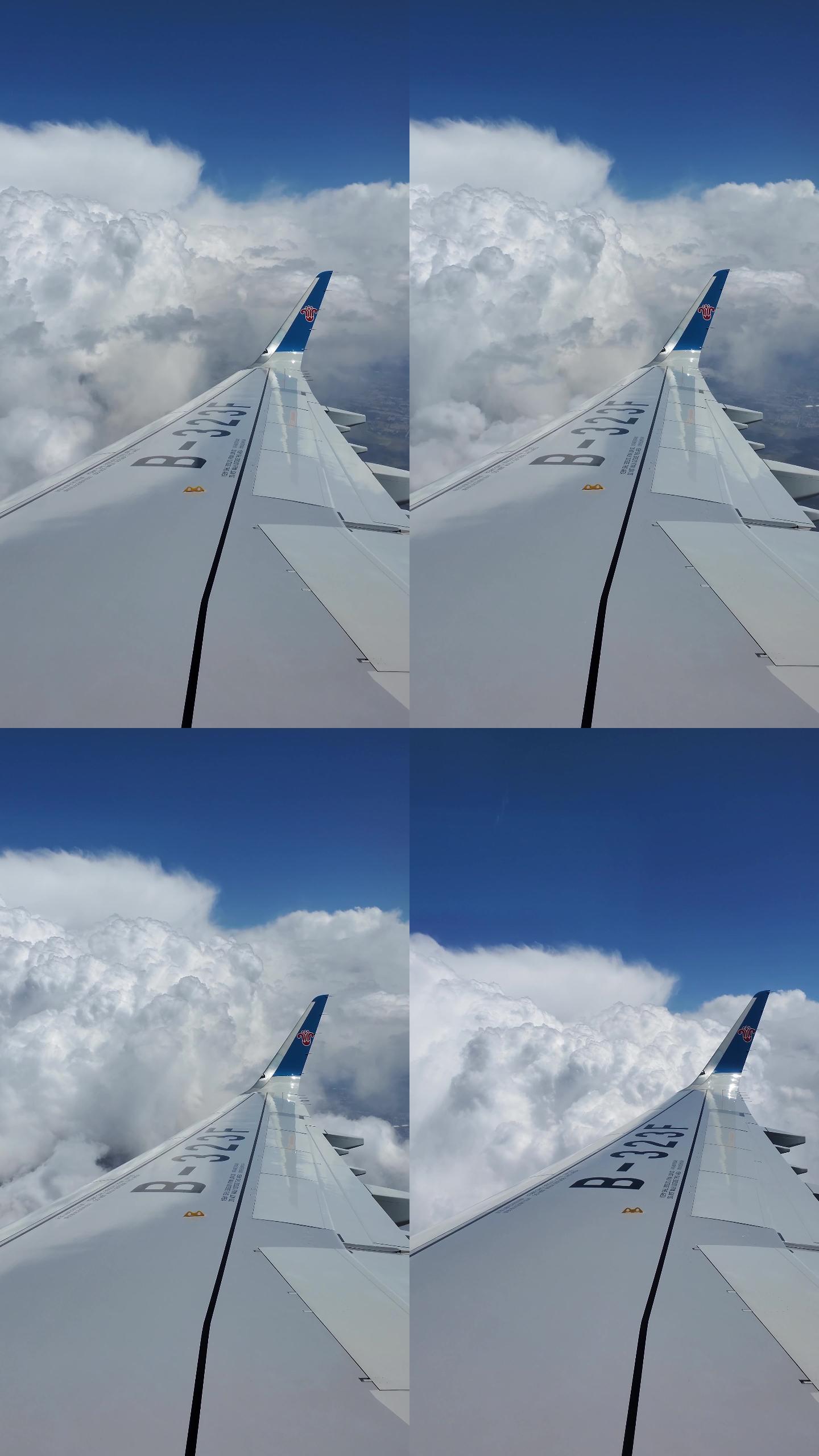 竖屏 飞机飞行中的机翼与天空云朵蓝天白云