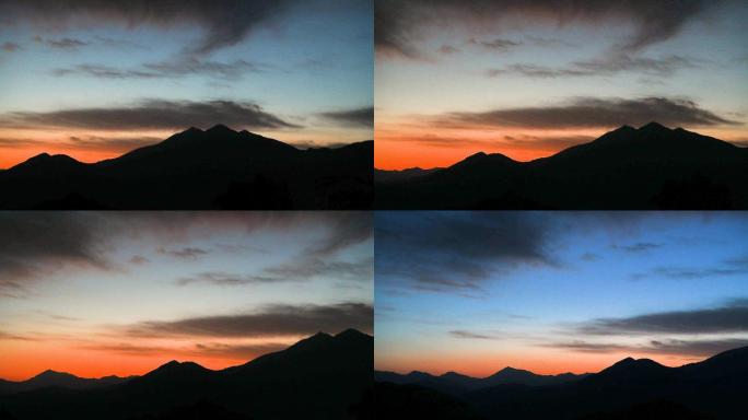 夕阳下的群山天空晚霞风景剪影