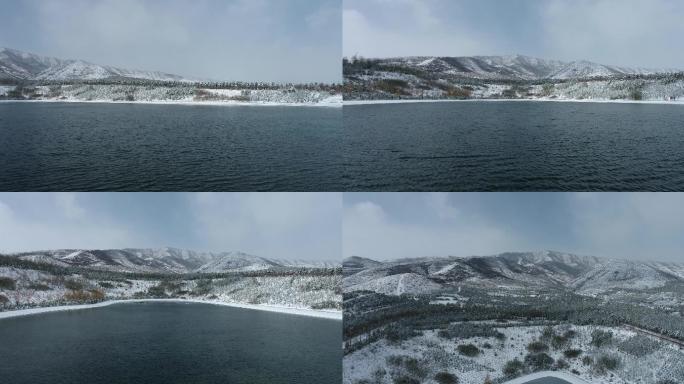 航拍雪后湖面大山