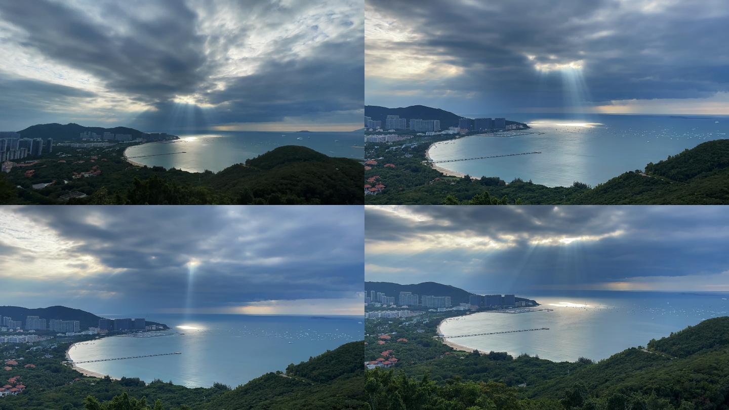 海南三亚海湾上空云层里射出来的耶稣光延时