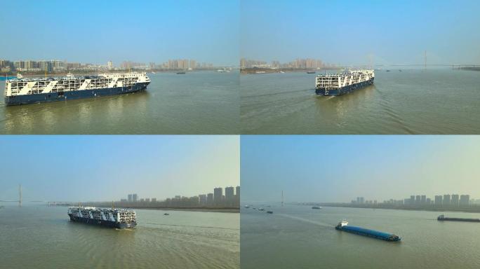 航拍安庆市长江航道运输汽车的巨型货轮