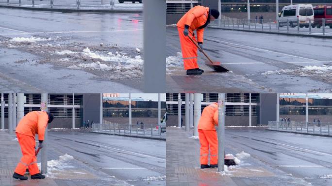 寒冷的冬天清洁工人清理路边积雪