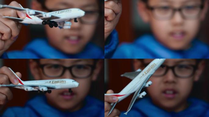 高清男孩玩飞机模型升格空镜