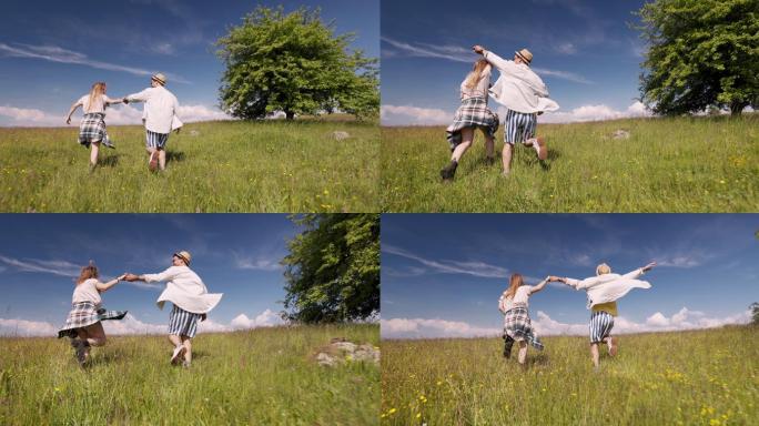 这对幸福的夫妇一起在草地上奔跑