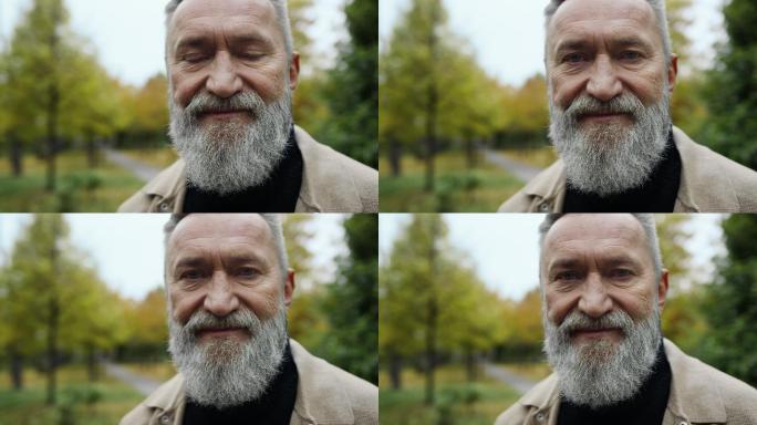 街道上微笑着留着胡子的男人的画像