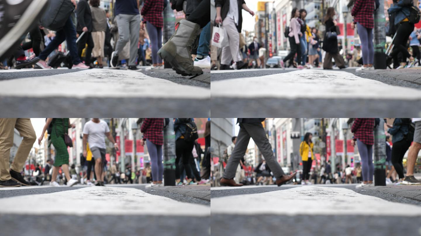 在人行横道上行走的腿部人士的特写镜头