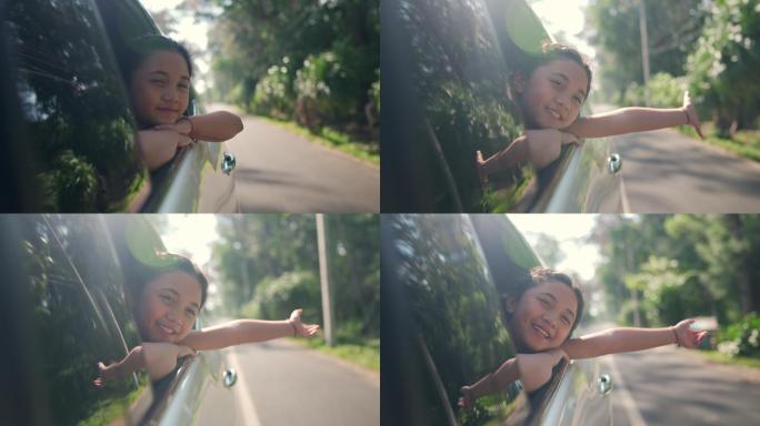 快乐的小女孩在公路旅行度假享受快乐。