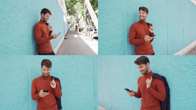 微笑的男人在用手机。