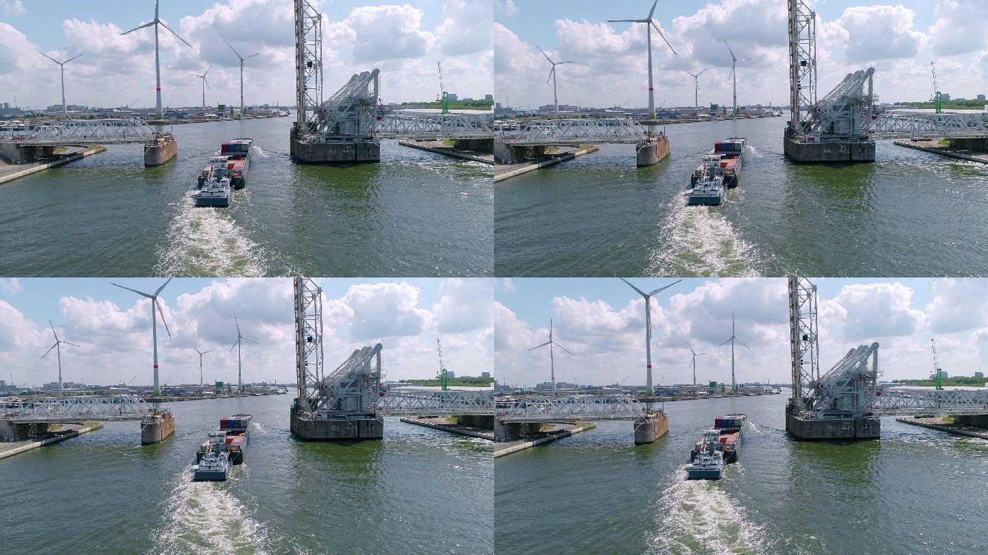 大桥闸门打开 船通过闸门驶出港口 风电