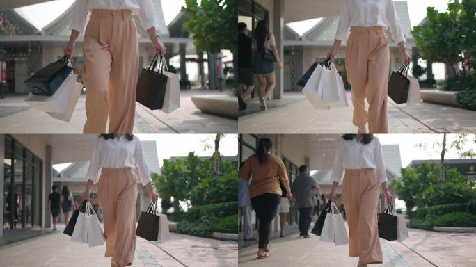 特写镜头：带着购物袋走路的女人