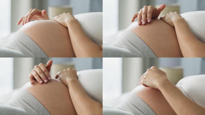 孕妇孕肚特写镜头孕期女人孕妇抚摸肚皮孕育
