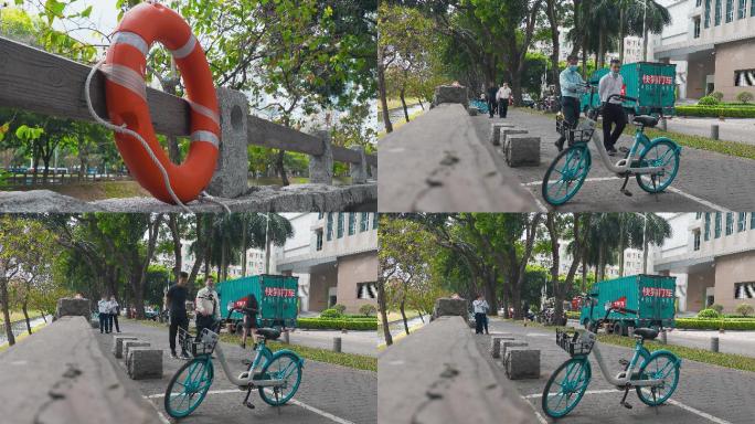 深圳新洲河畔救生圈岸边小路行人共享单车