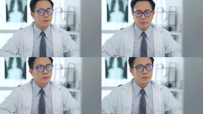 男医生在医务室使用电脑的特写镜头