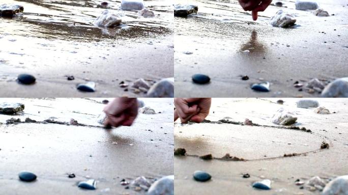 沙滩上的手指画圆圈