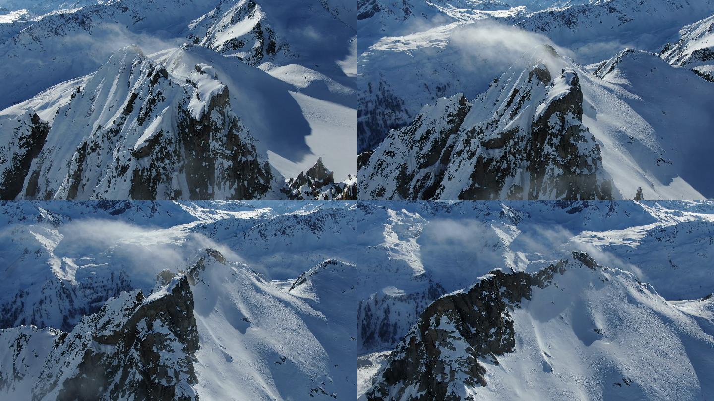 无人机俯瞰积雪覆盖的高山山脊