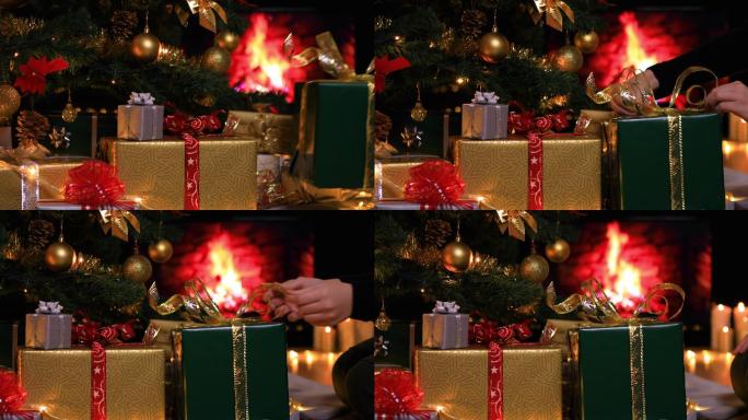 一名妇女将礼物放在壁炉旁的圣诞树下