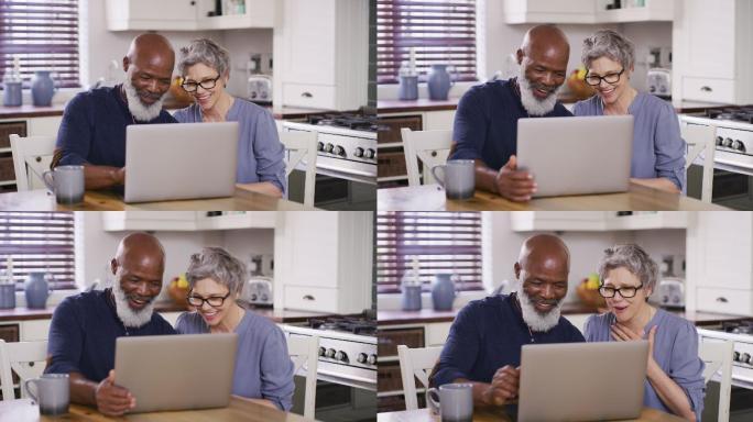 一对成年夫妇在家里使用笔记本电脑