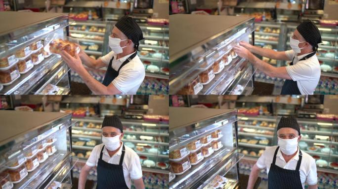 面包店员工在零售橱窗里摆放面包