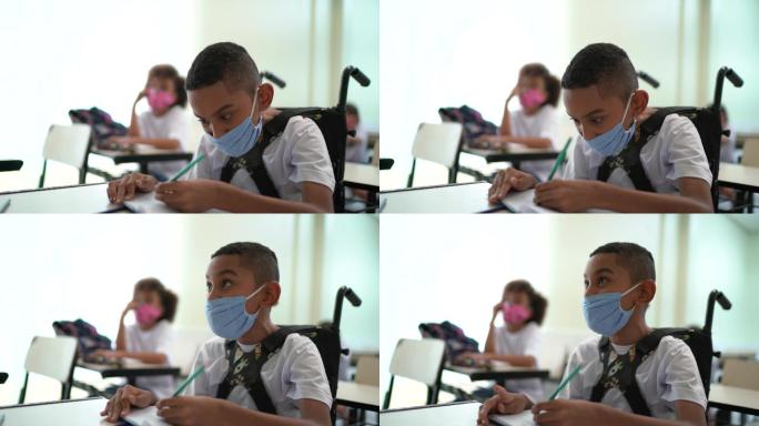 戴口罩在学校学习的残疾学童