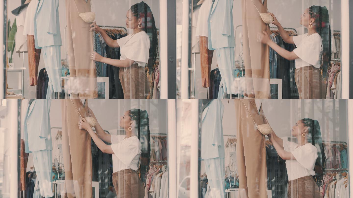 一名年轻女子在服装精品店工作