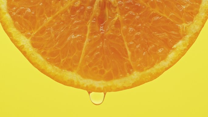 榨鲜橙汁广告空镜微距微观水滴滴落