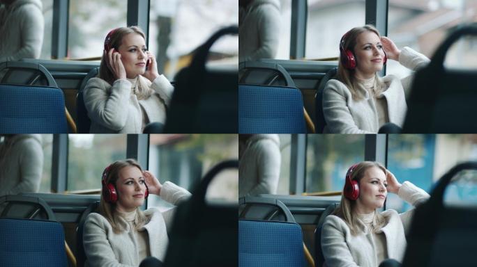 公共汽车上头戴耳机的妇女