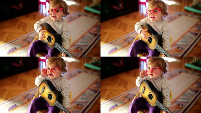 用吉他唱歌的可爱小女孩