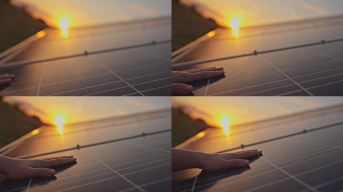 人类手触摸太阳能电池板