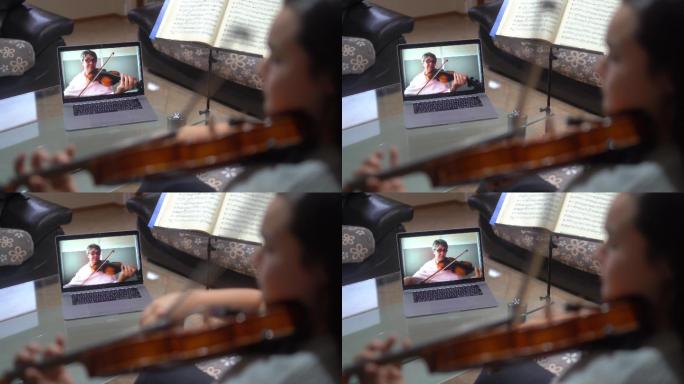 小提琴老师在网上教一个女孩如何拉小提琴