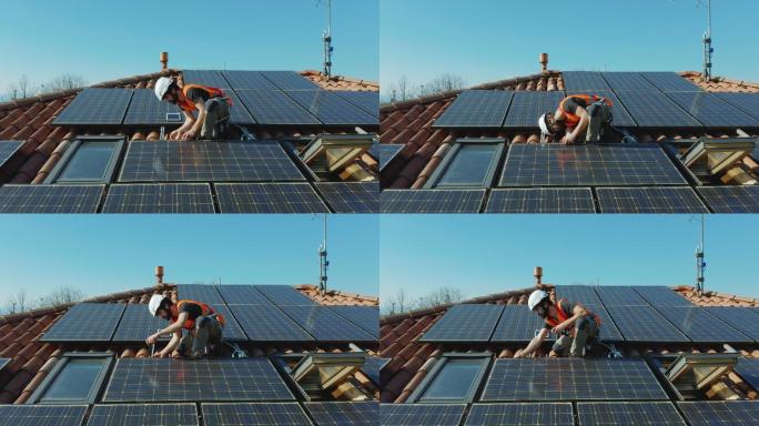 维护安装屋顶上的太阳能光伏板的技术人员。