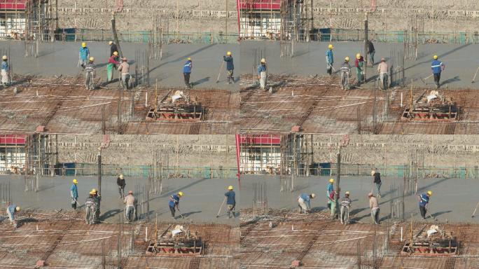 建筑工人浇筑水泥
