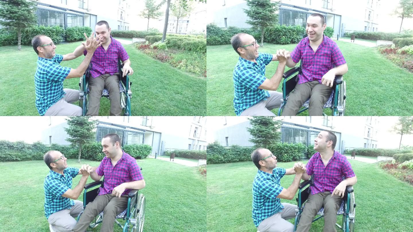 父亲和坐轮椅的残疾小男孩
