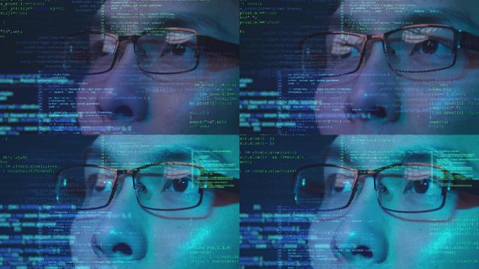 亚洲华人智能fintech程序员戴眼镜展望未来计算机编码、未来人工智能大数据技术概念。