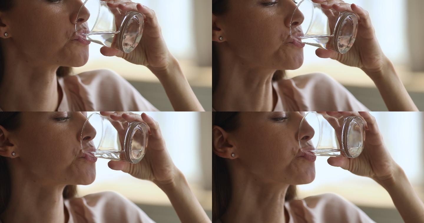 口渴的女性饮用新鲜纯净的过滤矿泉水