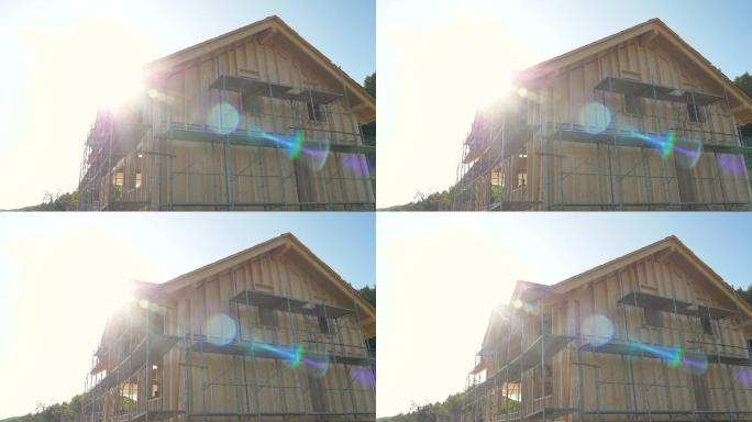 明亮的阳光照射在农村正在建造的木屋上