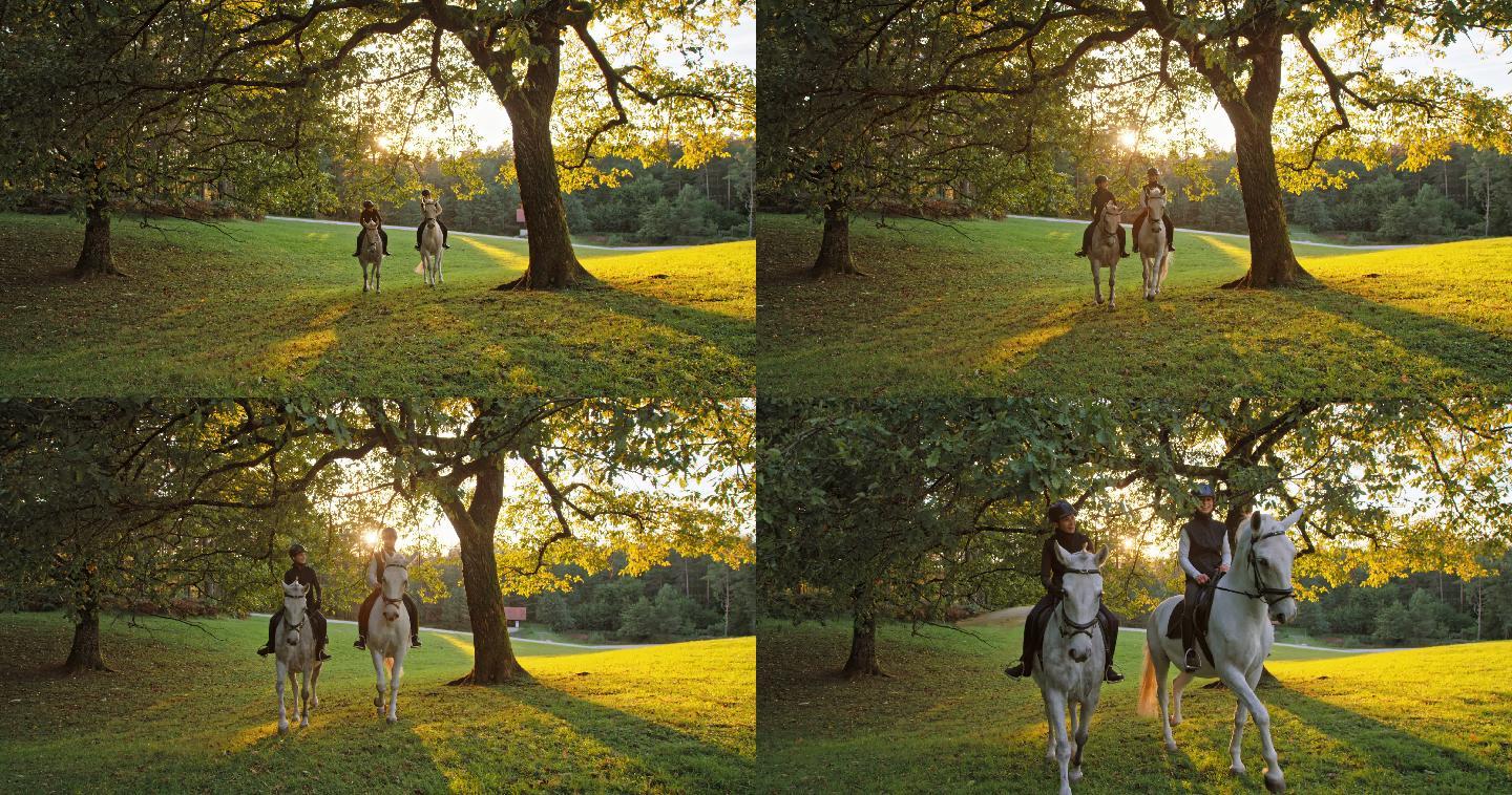 两位女性朋友在日落时骑马并享受彼此陪伴