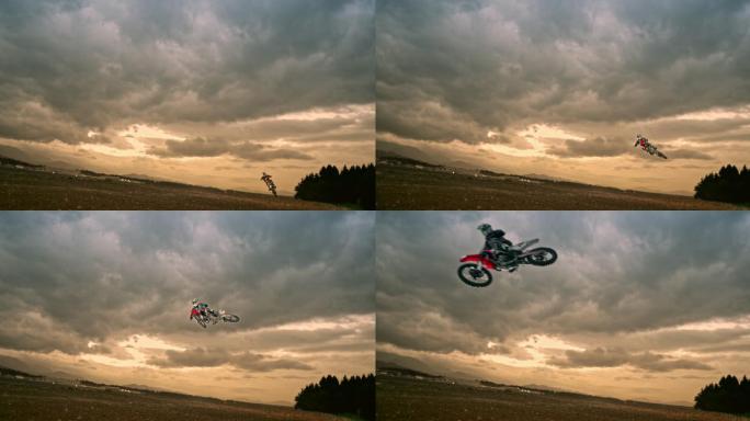 摩托车越野赛骑手在日落时跳跃