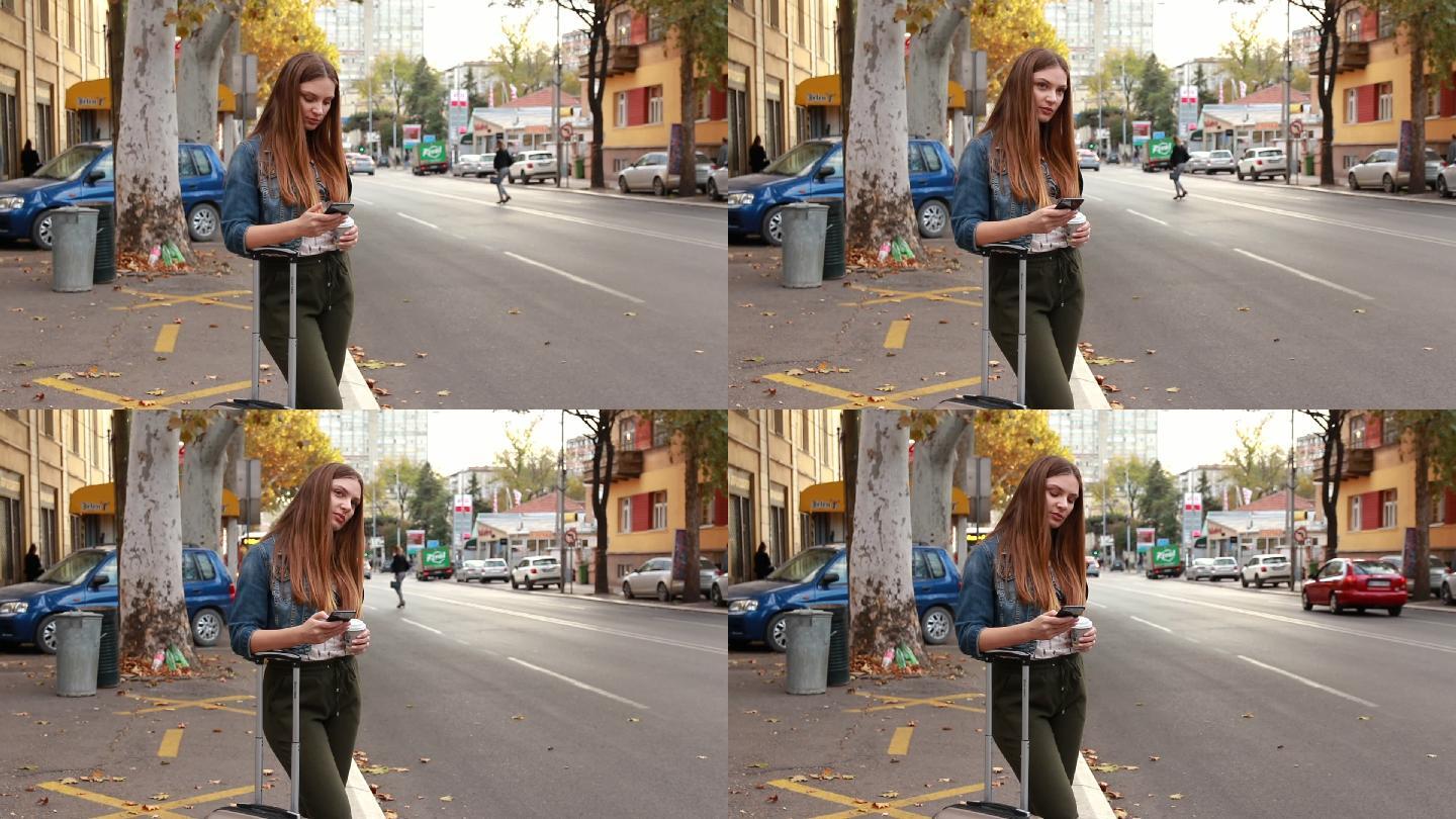 女人站在人行道上用手机找出租车