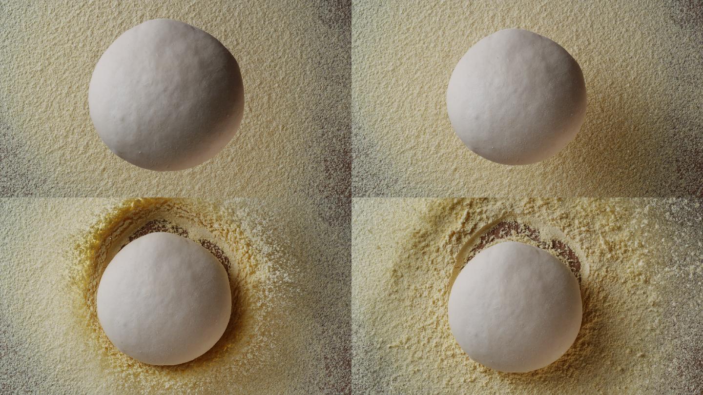 一个面团球落在一层薄薄的面粉上