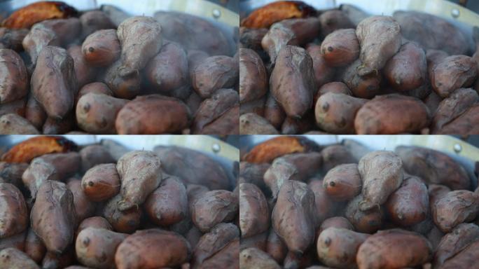 沿街小贩卖烤番薯特写原素材