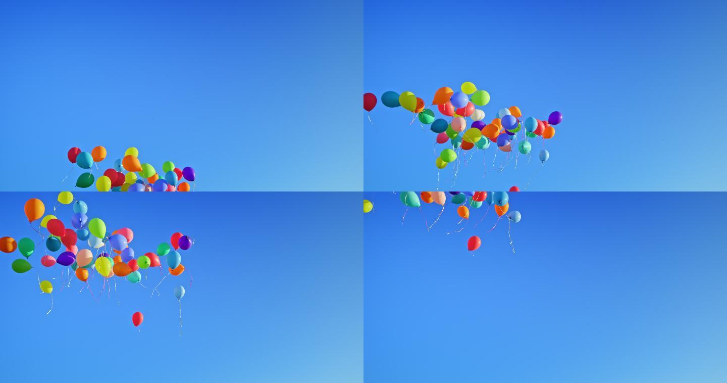 许多气球漂浮在晴朗的蓝天上