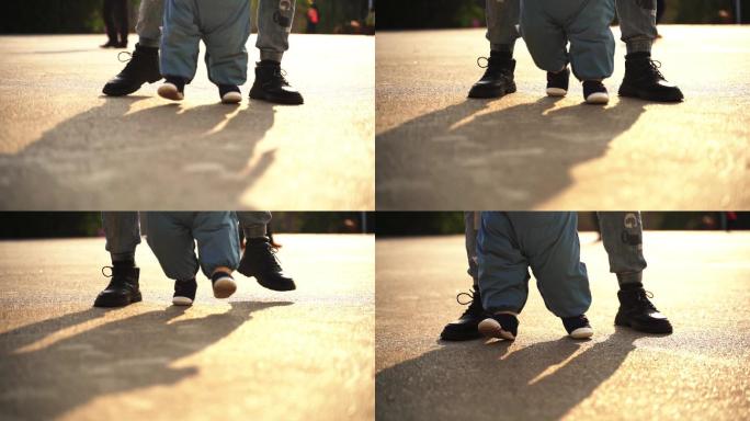 婴儿学步，婴儿学走路，爸爸搀扶婴儿学走路