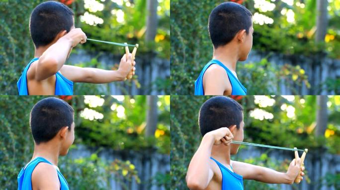 小男孩在玩弹弓童年游戏玩弹弓视频童真童趣