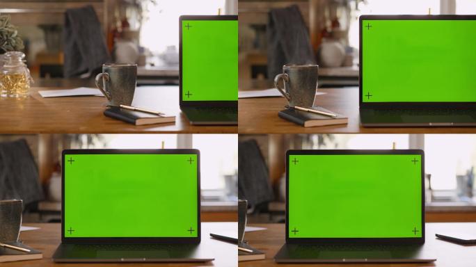 家中厨房的绿色屏幕笔记本电脑