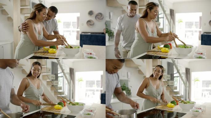 一对年轻夫妇在家的厨房里一起做饭