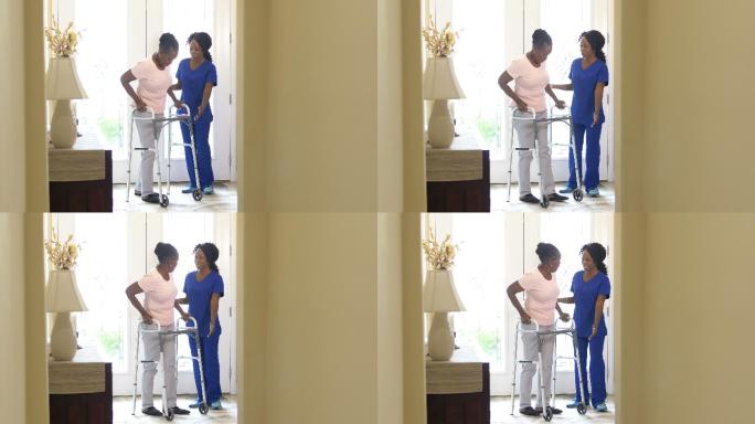 家庭医护人员帮助老年妇女使用助行器