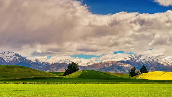 新西兰雪山蓝天白云绿草地延时摄影