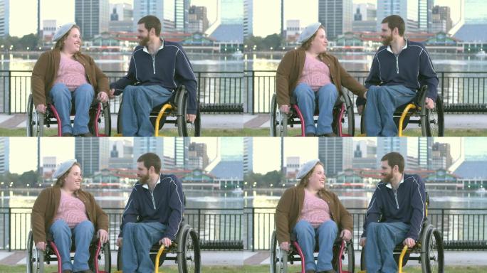 坐轮椅的夫妇在城市滨水区交谈