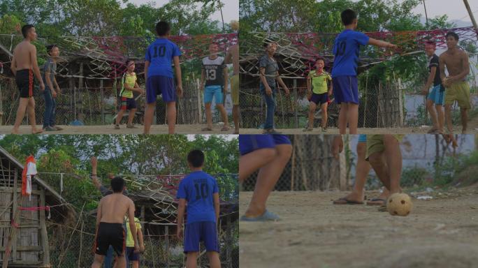 老挝农村的孩子们在踢球
