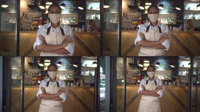 女咖啡店工作人员戴着防护面罩